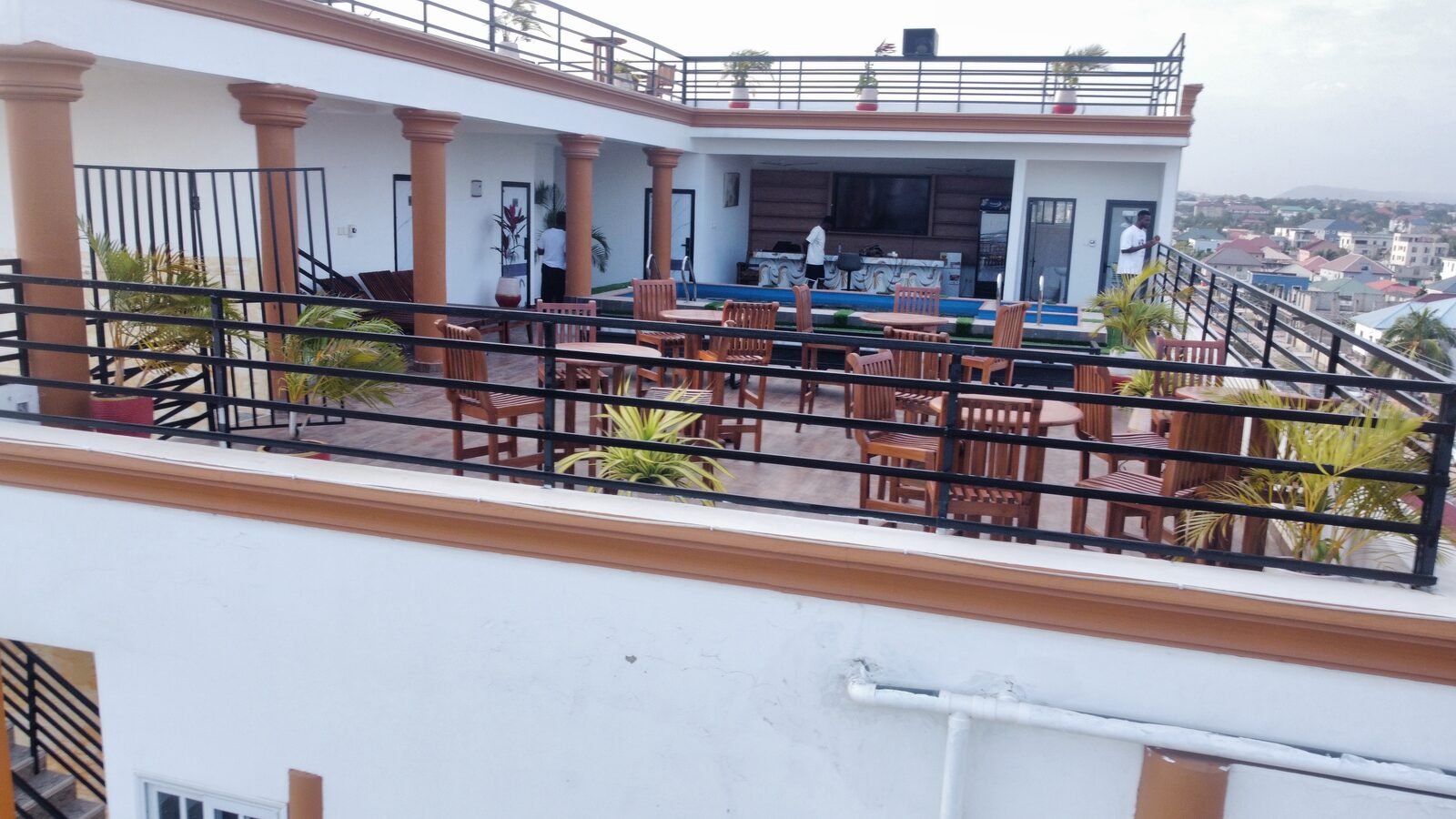 Skice rooftop terrace and pool with city skyline behind
