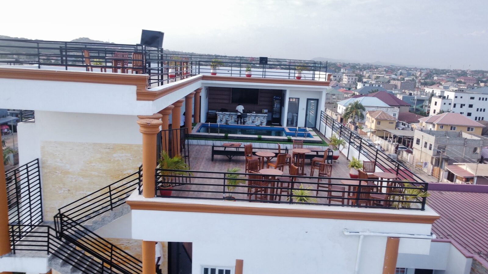 Skice rooftop bar counter and TV lounge with city views
